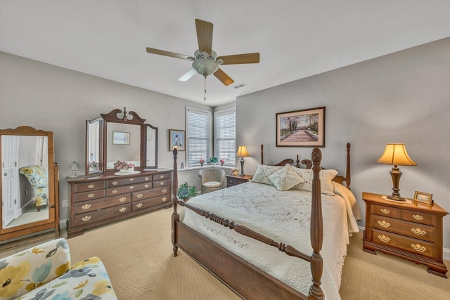 bedroom with carpet, visible vents, and a ceiling fan