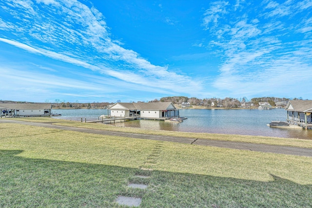 exterior space featuring a water view and a floating dock