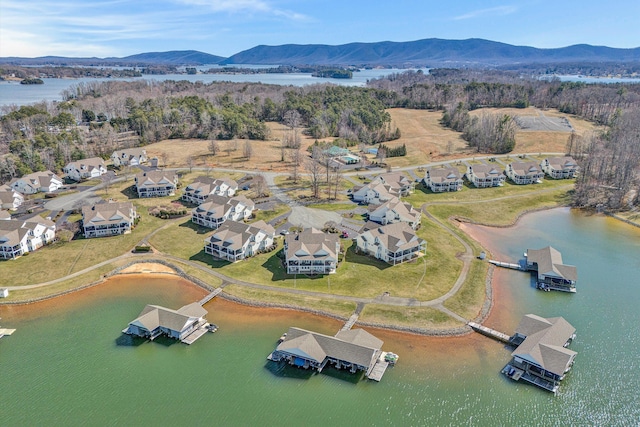 birds eye view of property featuring a water and mountain view