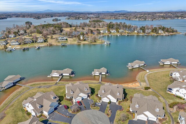 birds eye view of property featuring a residential view and a water and mountain view