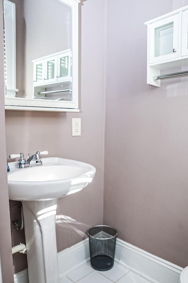 bathroom featuring tile patterned flooring and baseboards