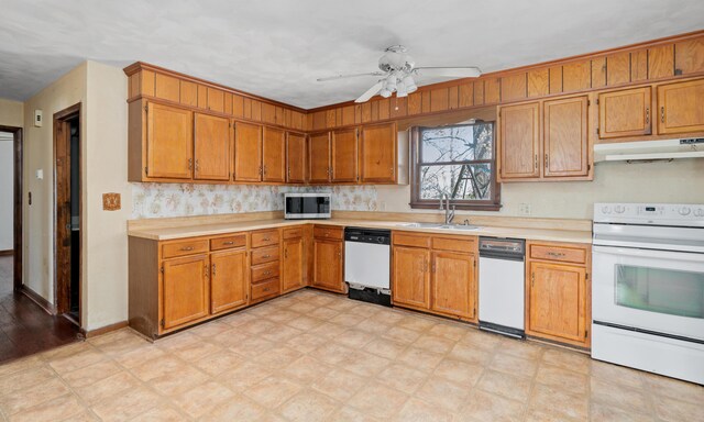 42 Keswick Ct, Troutville, VA 24175 - kitchen featuring brown cabinets, under cabinet range hood, light countertops, a sink, and white appliances
