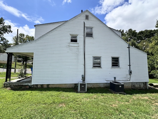 view of property exterior featuring cooling unit and a yard