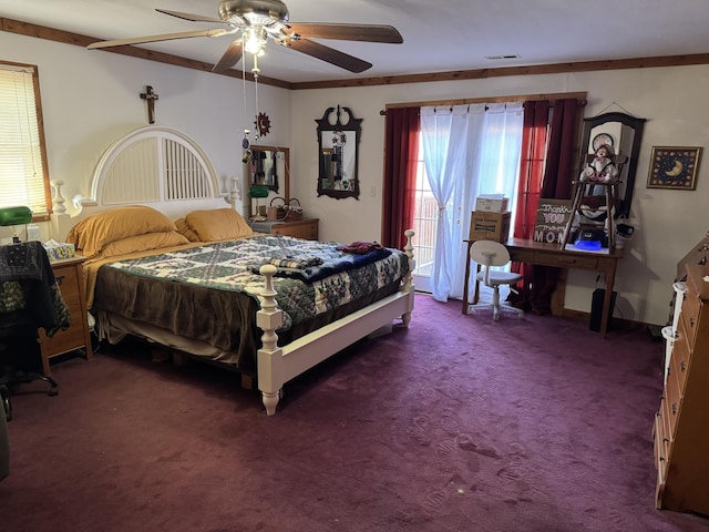 carpeted bedroom with ornamental molding, visible vents, and ceiling fan