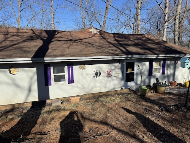 view of front of house with roof with shingles