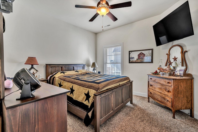 bedroom with a ceiling fan, baseboards, visible vents, and carpet flooring