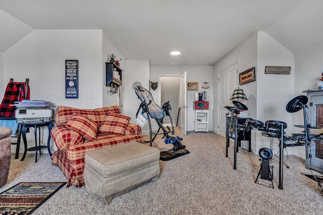 workout area featuring carpet, vaulted ceiling, and baseboards