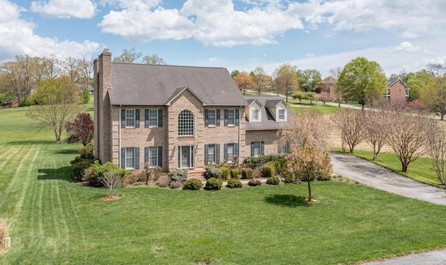 56 Savannah Ct, Daleville, VA 24083 - view of front facade with brick siding, a chimney, and a front yard