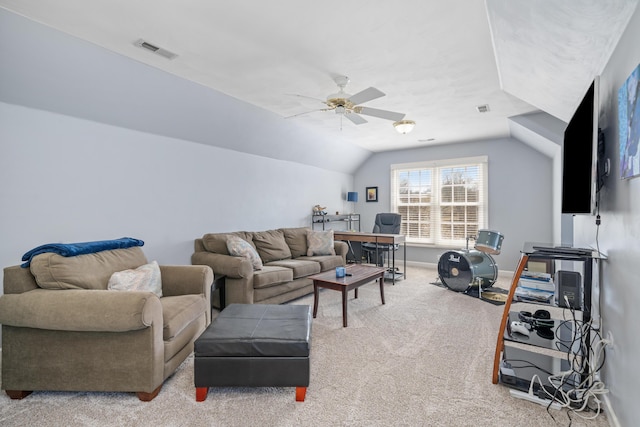 living area featuring ceiling fan, carpet flooring, visible vents, baseboards, and vaulted ceiling