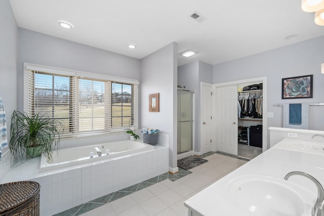 56 Savannah Ct, Daleville, VA 24083 - bathroom with a bath, a sink, double vanity, and a stall shower
