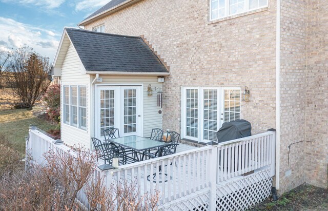 56 Savannah Ct, Daleville, VA 24083 - exterior space featuring roof with shingles, brick siding, outdoor dining space, and a deck
