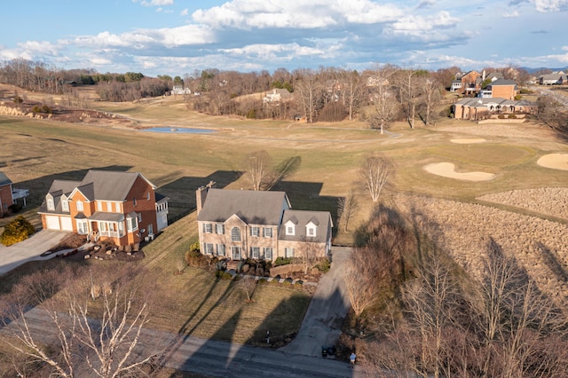 birds eye view of property with golf course view