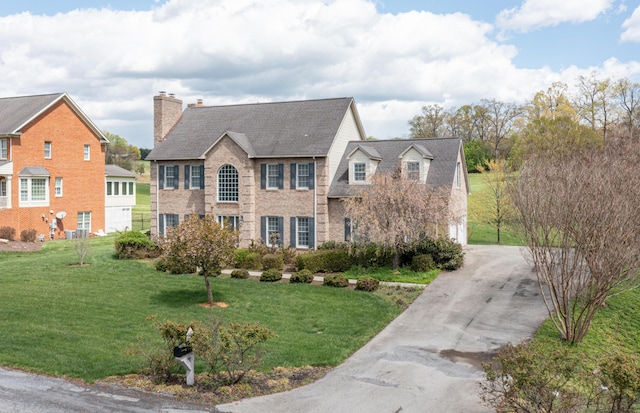 56 Savannah Ct, Daleville, VA 24083 - view of front of home with a chimney, a front lawn, driveway, and brick siding