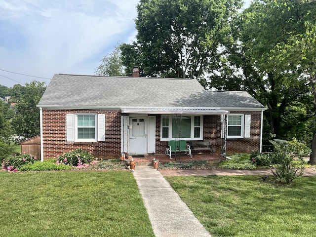 23 Upland Dr, Salem, VA 24153 - view of front of home featuring brick siding, a porch, and a front yard