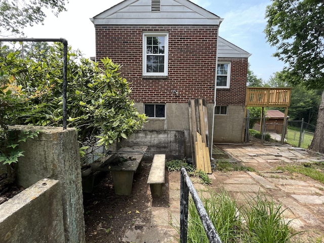 23 Upland Dr, Salem, VA 24153 - view of side of home with brick siding and a gate