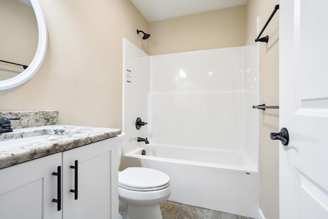 bathroom with toilet, vanity, and shower / tub combination