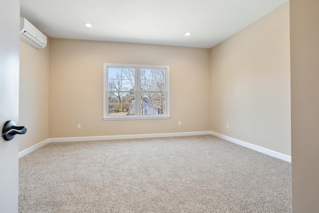 carpeted spare room with recessed lighting, an AC wall unit, and baseboards