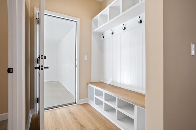 mudroom with light wood-type flooring and baseboards