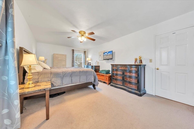 carpeted bedroom with a ceiling fan