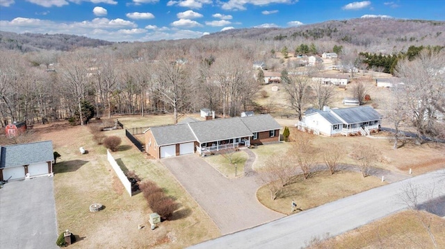 aerial view featuring a wooded view