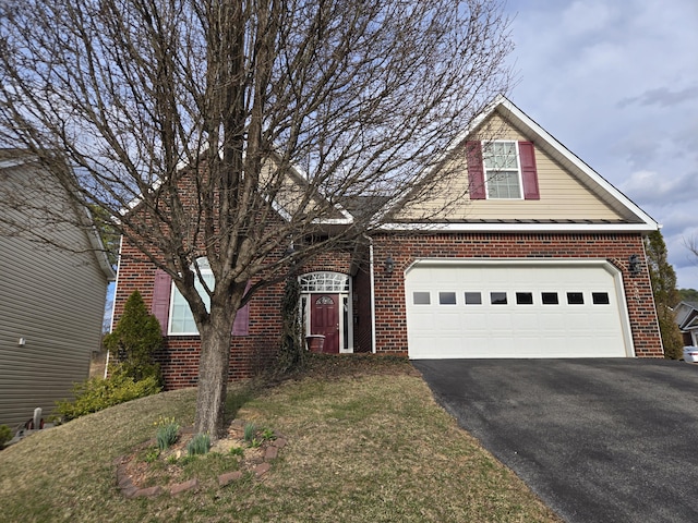 view of front of property with a garage, brick siding, and driveway