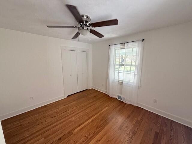 3387 Harborwood Rd, Salem, VA 24153 - unfurnished bedroom featuring a closet, a ceiling fan, baseboards, and wood finished floors