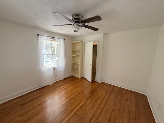 3387 Harborwood Rd, Salem, VA 24153 - unfurnished bedroom featuring a ceiling fan, wood finished floors, and baseboards