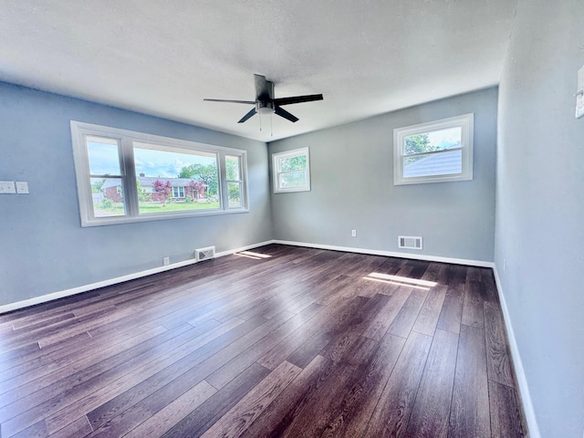 418 Victor Ave NE, Roanoke, VA 24012 - unfurnished room featuring baseboards, ceiling fan, dark wood-style flooring, and visible vents