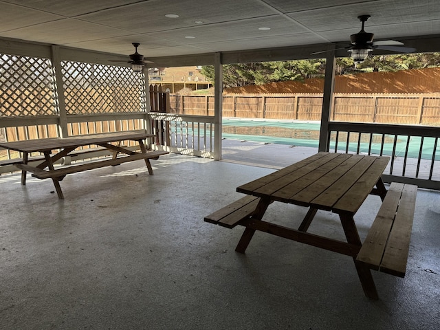 view of patio with a fenced in pool, a fenced backyard, and a ceiling fan