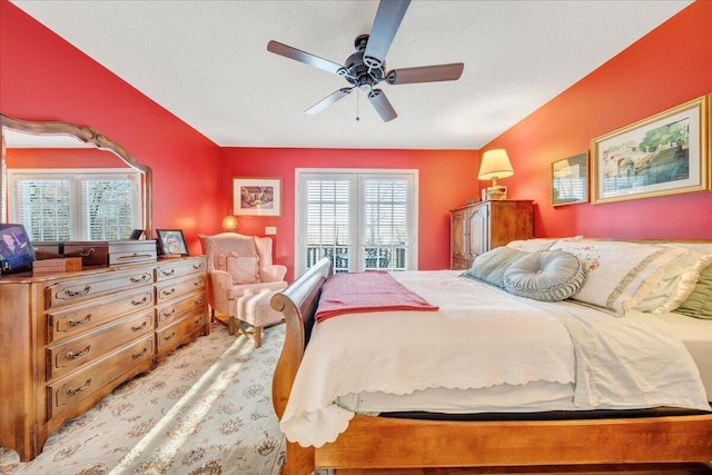 bedroom with lofted ceiling and a ceiling fan