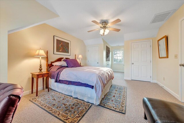 carpeted bedroom featuring baseboards and visible vents