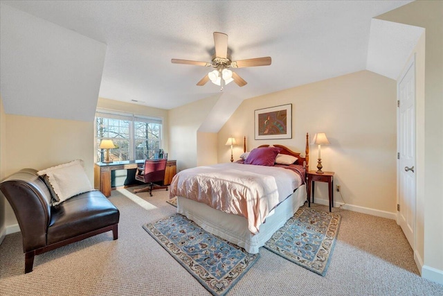 bedroom featuring a ceiling fan, vaulted ceiling, carpet, and baseboards