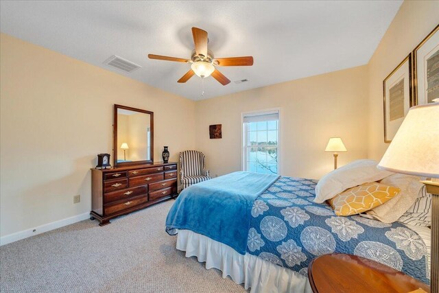 living area featuring visible vents and carpet floors