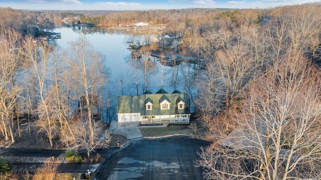 bird's eye view with a view of trees and a water view