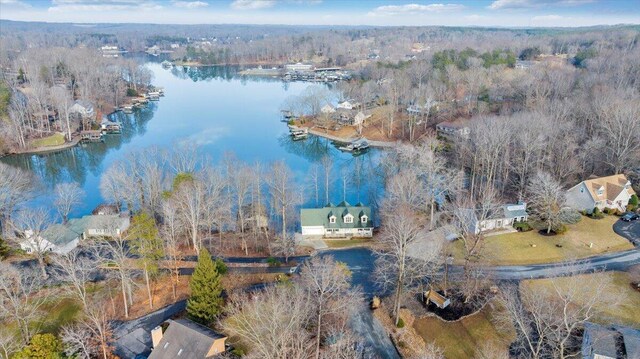 bird's eye view featuring a view of trees and a water view