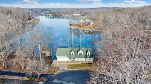 bird's eye view featuring a view of trees and a water view