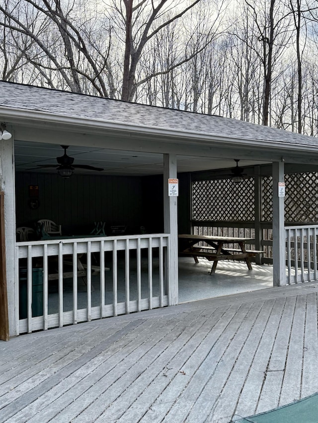 wooden deck featuring a ceiling fan