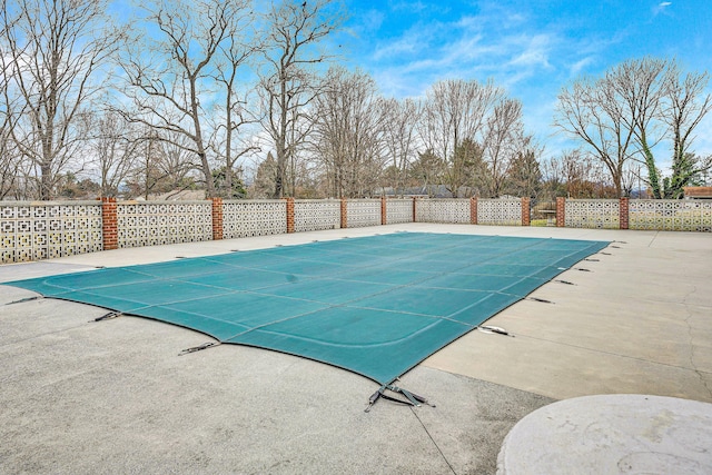 view of swimming pool with a fenced in pool, a patio area, and fence