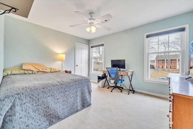 bedroom featuring ceiling fan, carpet flooring, visible vents, baseboards, and a closet