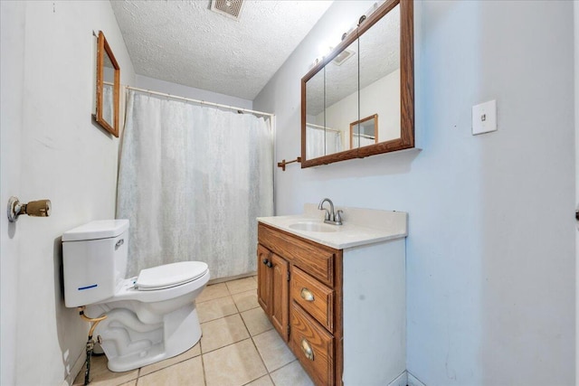 bathroom with visible vents, toilet, tile patterned floors, a textured ceiling, and vanity