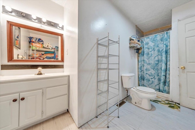 full bathroom with a shower with shower curtain, a textured ceiling, toilet, and vanity