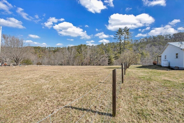 view of yard featuring a view of trees