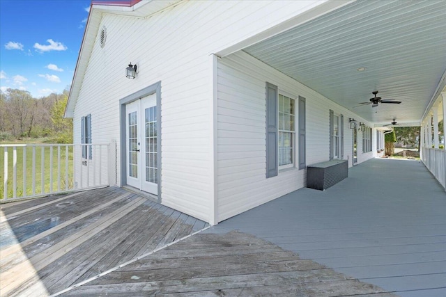 deck with french doors and a ceiling fan