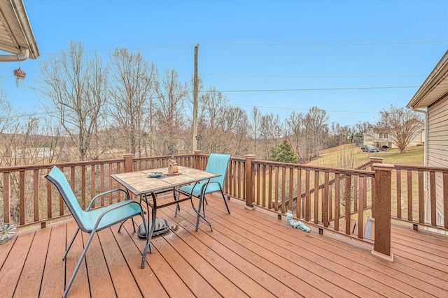 deck featuring outdoor dining area