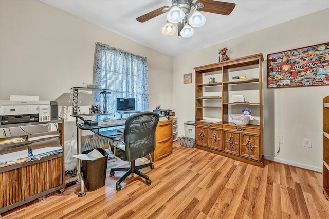 home office featuring ceiling fan, baseboards, and wood finished floors