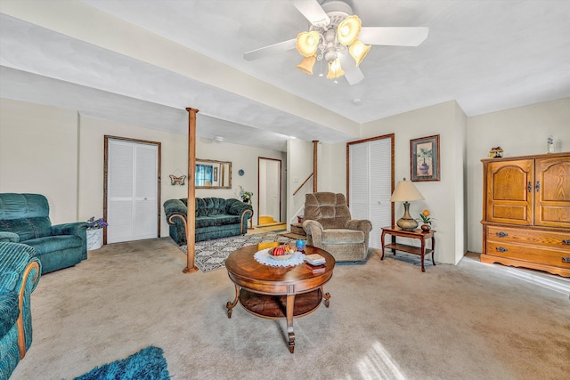 living area with carpet floors and a ceiling fan