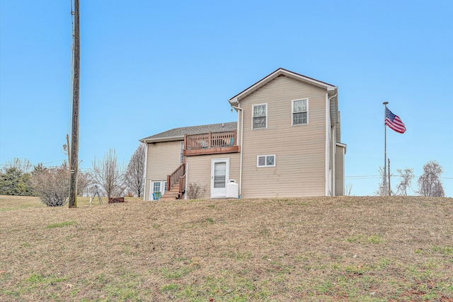 back of house with a yard