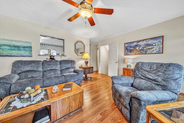 living room featuring ceiling fan and light wood-type flooring