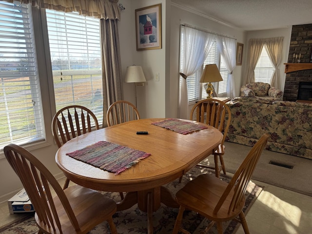 dining room with a textured ceiling and visible vents