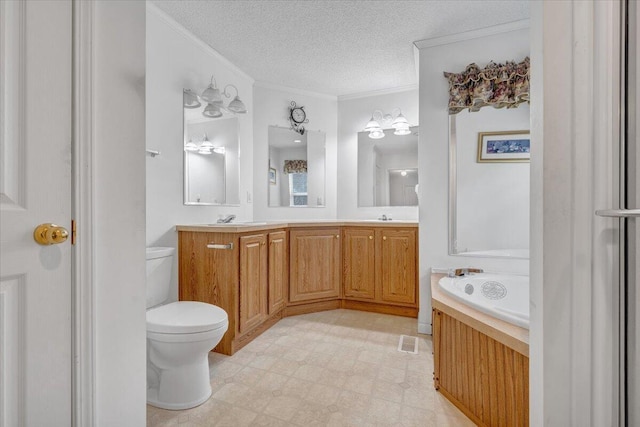 full bathroom featuring a textured ceiling, ornamental molding, toilet, a sink, and tile patterned floors